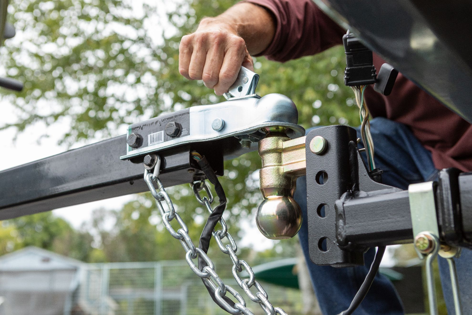 A trailer being hooked up to tow vehicle