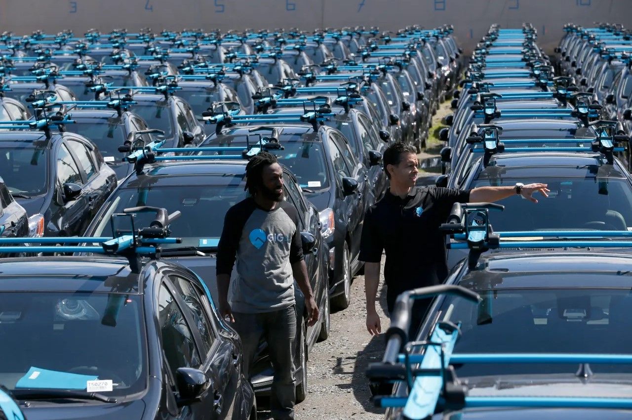 carshare vehicle fleet with custom colored bike and ski racks 