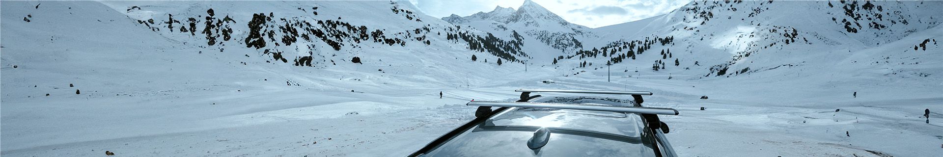 a roof rack on a car on a snowy mountain